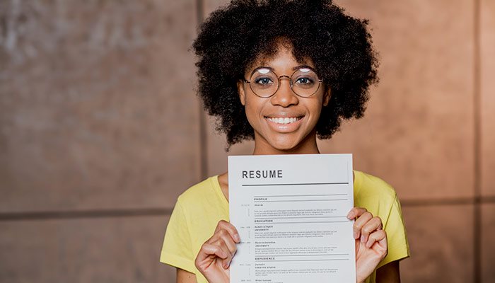 Woman holding up resume