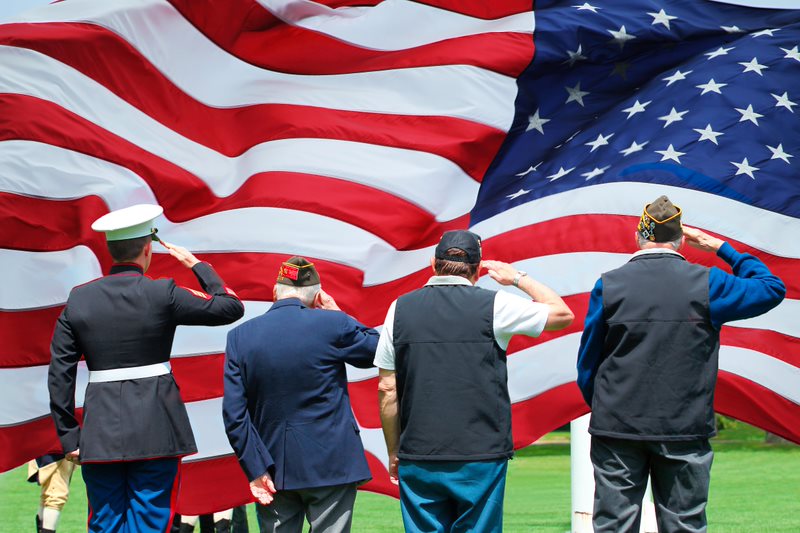 Veterans Saluting American Flag